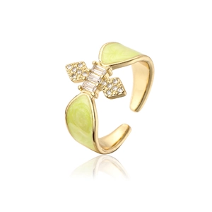 Detail of 18K gold plated ring with green enamel inlay and sparkling zircon stones