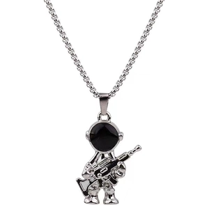 Detailed view of silver astronaut pendant holding a rifle with a sleek box chain