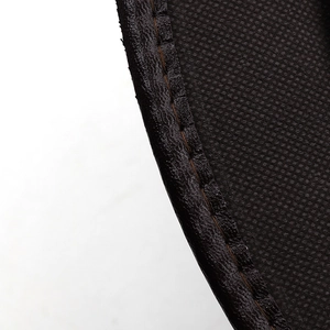 Close-up of deep brown leather cowboy hat edge with detailed stitching and mesh lining