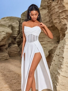 White backless strapless high slit evening dress with rhinestone waist in desert landscape