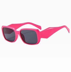 Side view of trendy bright pink rectangle sunglasses with thick retro frames and dark lenses