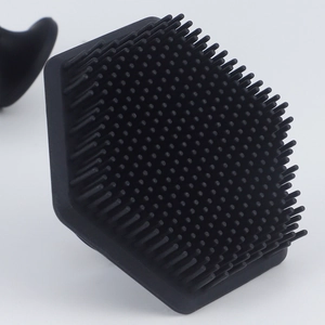 Black hexagonal silicone face and beard cleansing brush with soft massage bristles