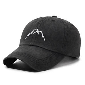 Vintage black washed cotton baseball cap with mountain embroidery and distressed texture