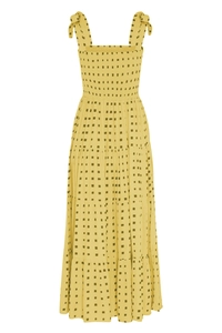 Detail of yellow floral maxi dress with bow shoulder straps and tiered skirt design