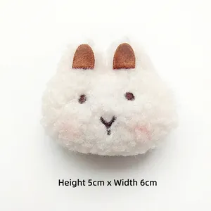 Detailed view of white plush cartoon animal head accessory, dimensions 5cm height by 6cm width