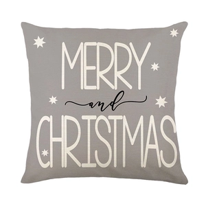 Christmas pillow cover in grey with white stars and Merry Christmas typography on linen