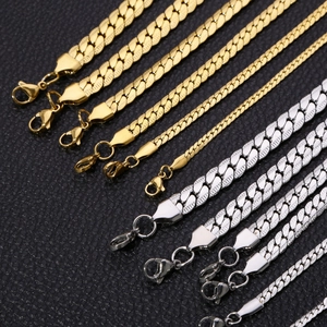 Gold and silver stainless steel Cuban curb chains in various thicknesses on black leather
