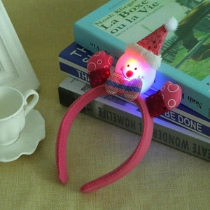 Pink LED Christmas headband featuring sequined snowman ears for festive party accessory