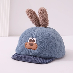 Detail of plush baby baseball cap with bunny ears and soft quilted fleece texture