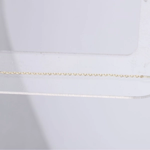 Close-up of a S925 sterling silver gold-plated long chain featuring five-pointed stars