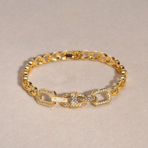 Elegant gold-plated chain bracelet featuring leaf and heart motifs with zircon inlays