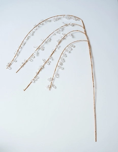 Close-up of golden branches with clear acrylic beads for Christmas tree decoration