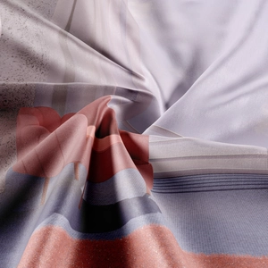 Macro detail of silk-like bohemian tapestry fabric with abstract geometric patterns