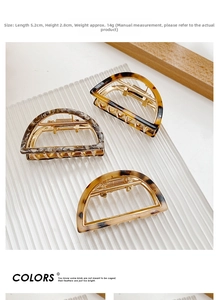 Detailed view of three acetate hair claws in marble and tortoiseshell, 5.2cm size