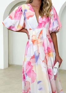 Close-up of watercolor floral print on white puff sleeve V-neck summer dress