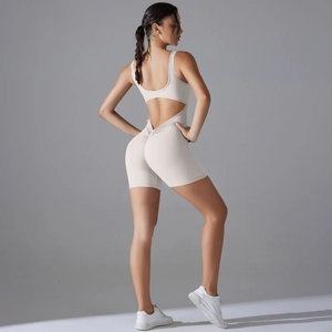 Detail of off-white yoga romper showing scrunch butt design and back cut-out detail