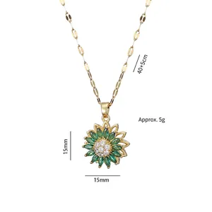 Gold sunflower necklace with emerald green petals and white zircon center stone