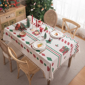Beige Christmas tablecloth with festive gift patterns and elegant fringe tassels