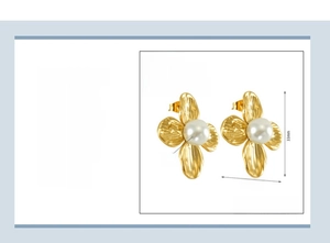 Detail view of 18K gold plated stainless steel petal earrings with white pearl center