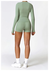 Back view of a slim-fit long-sleeve yoga top and matching sage green fitness shorts set