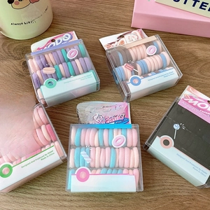 Set of 40 macaron-colored small kids' hair elastics in five compact storage boxes