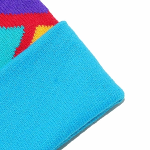 Macro shot of colorful heart jacquard knitting and blue ribbed cuff texture