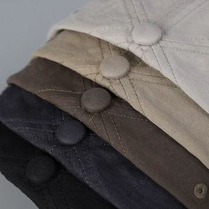 Close-up of baseball cap twill cotton texture with neat stitching and fabric button