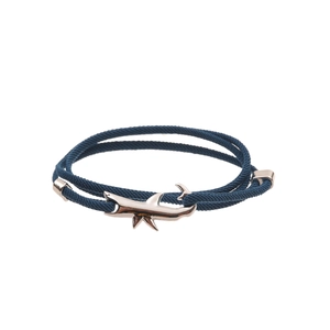 Detail of dark blue double-strand rope bracelet with silver shark hook and adjustable clasp