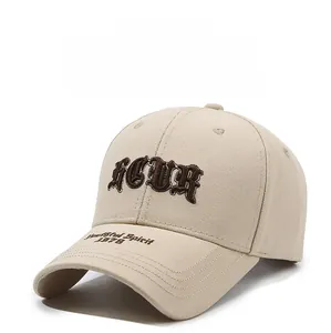 Close-up of 3D embroidered ICUR logo and Youthful Spirit text on beige cotton baseball cap
