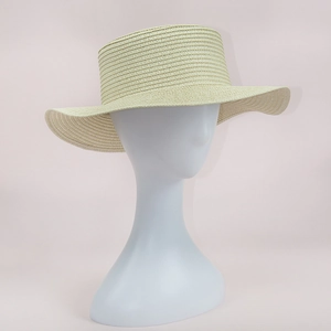 Macro shot of breathable beige woven straw hat base with spiral texture on mannequin