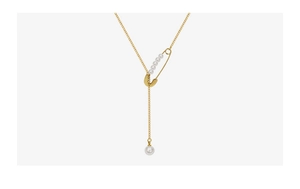 Detail of gold safety pin pendant with white pearls on a long drop necklace chain