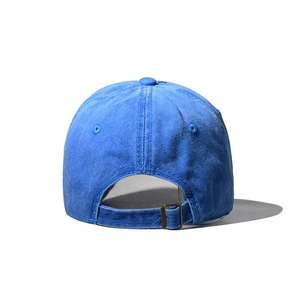 Detail view of the washed blue cotton baseball cap back with adjustable metal buckle strap