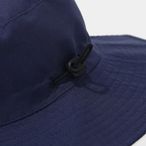 Detail of dark blue sun hat featuring adjustable toggle drawcord and reinforced brim stitching