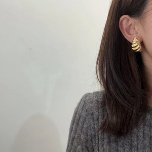 Fashionable gold twisted hoop earrings for women with a minimalist geometric metal design