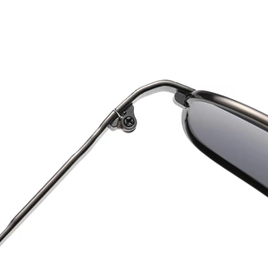 Macro shot of durable metal hinge and screw detail on polarized men's sunglasses