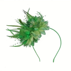 Detailed view of a green fascinator headpiece with elegant feathers and beadwork