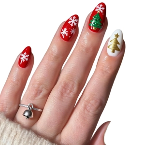 Christmas almond press-on nails with red and white snowflake and tree designs