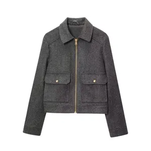 Detailed view of dark grey wool jacket featuring a lapel collar and metal zipper