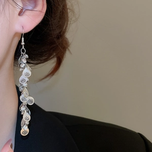 Silver long drop earrings featuring crystal sequins and spiral tassel pendant design