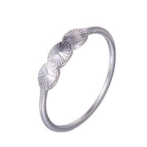 Classic silver minimalist ring with three textured circular motifs on a white background