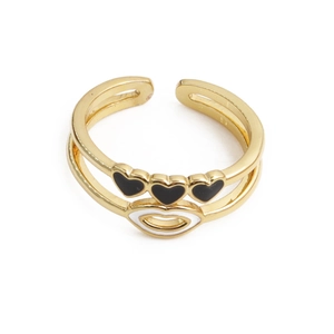 Detail of adjustable gold ring featuring black enamel hearts and a white enamel lip icon