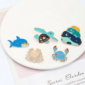 Five-piece cartoon enamel brooch set featuring shark, turtle, frog, rabbit and crab designs