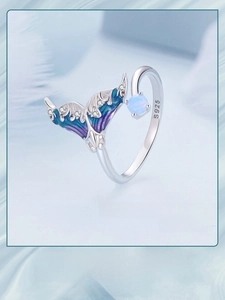 Macro detail of S925 silver fishtail ring with blue enamel and sparkling crystal accents