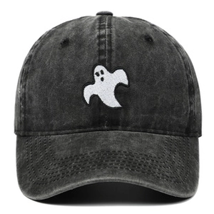 Detailed close-up of ghost embroidery on a vintage washed grey cotton baseball cap