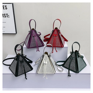 Close-up of pyramid crystal bags in five colors with drawstring closure and shoulder straps