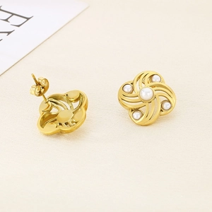 18K gold-plated flower stud earrings with elegant shell pearls on a cream background