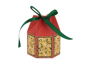 Detail of red hexagonal gift box with green ribbon and textured floral side panels