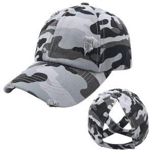 Close-up of urban camouflage baseball cap with distressed details and ponytail cross bands