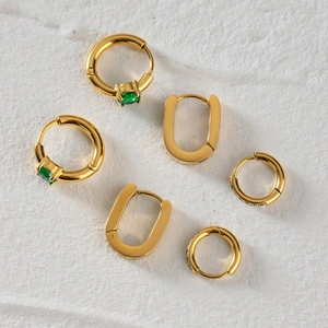 Three-piece gold stainless steel hoop earrings set with green cubic zirconia stones