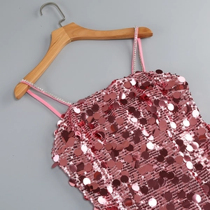 Detail of pink sequin dress showing dense rhinestones on the shoulder straps